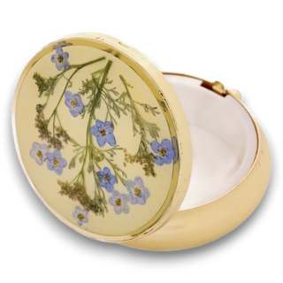 Round pillbox with ballerina and moss